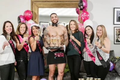 Butler in the Buff serving drinks to hens at a hen party